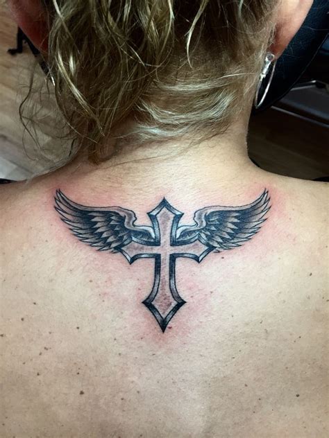 angel on cross tattoo|cross with wings tattoo design.